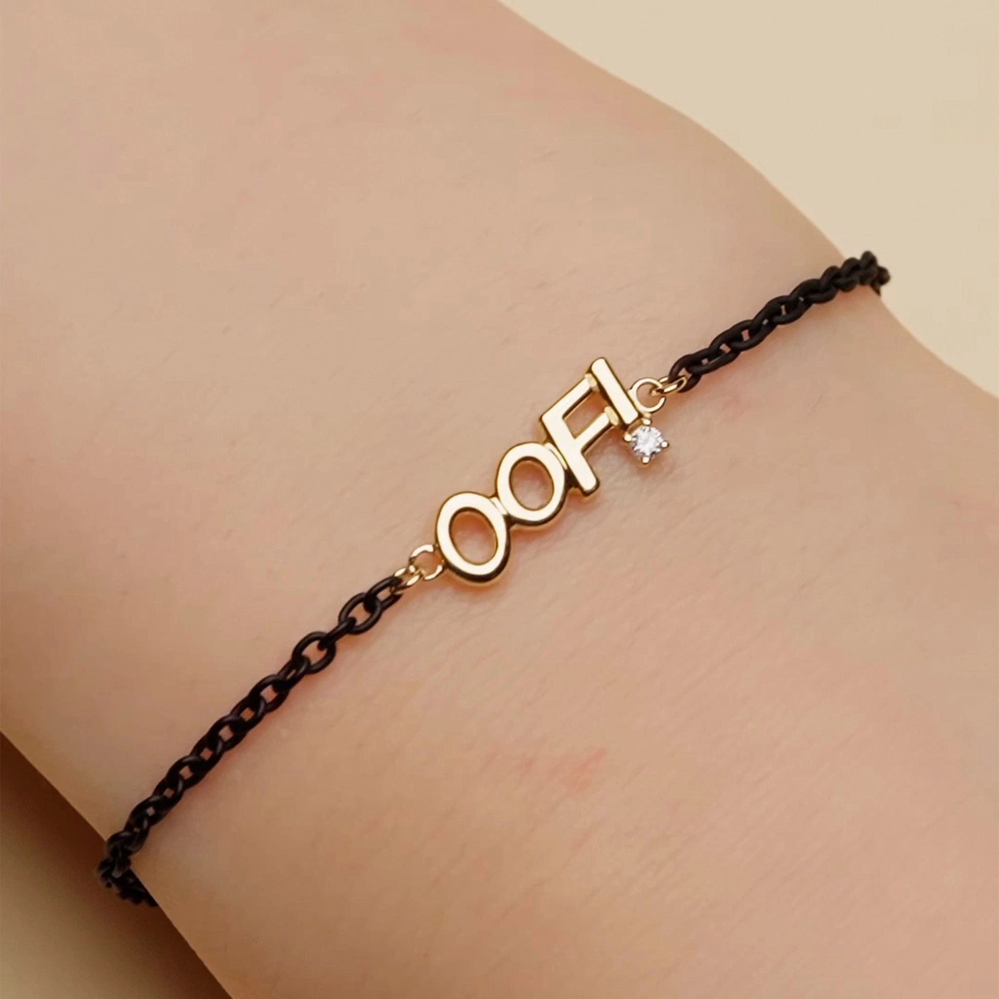 18K Gold and Black Steel “OOF” Bracelet